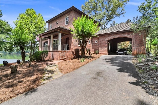 4043 Piedmont Lake Rd, Pine Mountain, GA 31822 - view of front of home with asphalt driveway, brick siding, and covered porch
