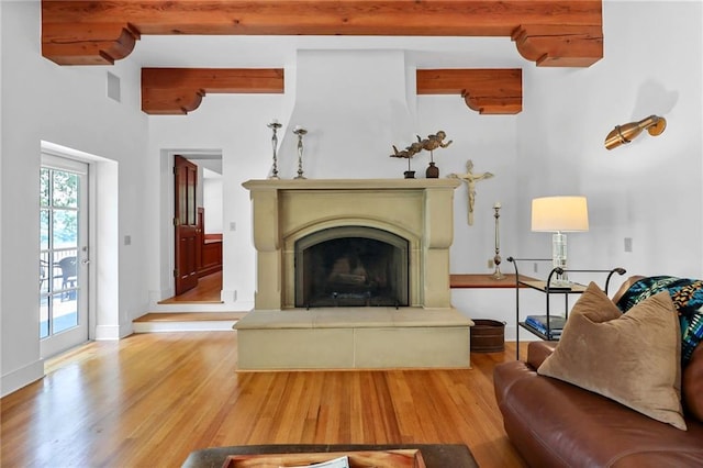 4043 Piedmont Lake Rd, Pine Mountain, GA 31822 - living room with wood finished floors, a fireplace with raised hearth, baseboards, and beam ceiling