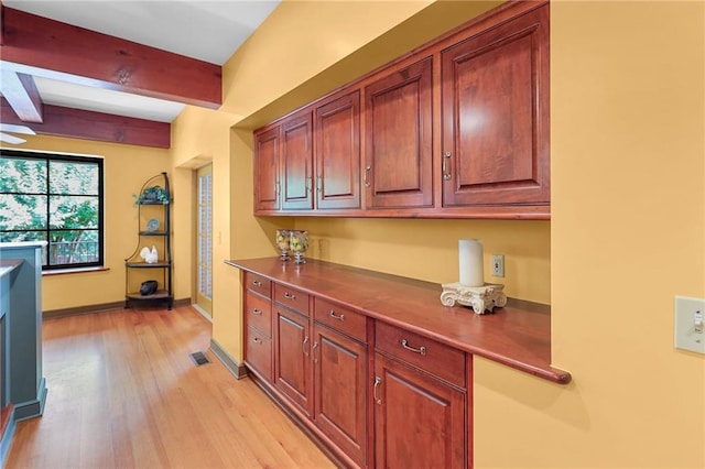 4043 Piedmont Lake Rd, Pine Mountain, GA 31822 - kitchen with beamed ceiling, light wood finished floors, baseboards, and dark countertops