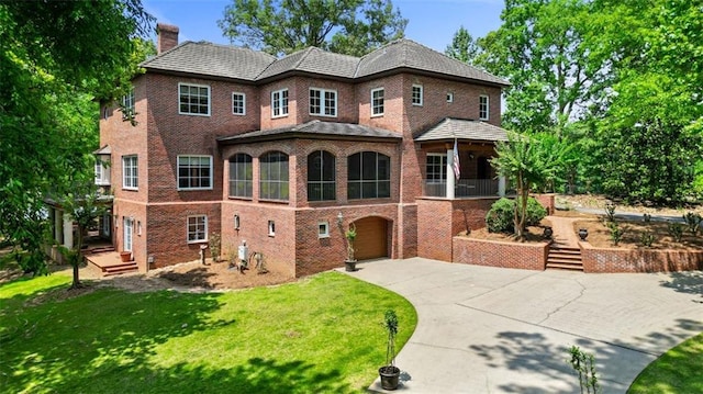 4043 Piedmont Lake Rd, Pine Mountain, GA 31822 - view of front facade featuring driveway, a chimney, a garage, brick siding, and a front lawn