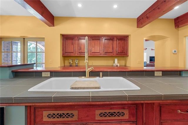 4043 Piedmont Lake Rd, Pine Mountain, GA 31822 - kitchen featuring a sink, beamed ceiling, recessed lighting, arched walkways, and tile counters