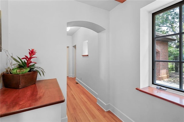 4043 Piedmont Lake Rd, Pine Mountain, GA 31822 - corridor with arched walkways, light wood finished floors, healthy amount of natural light, and baseboards