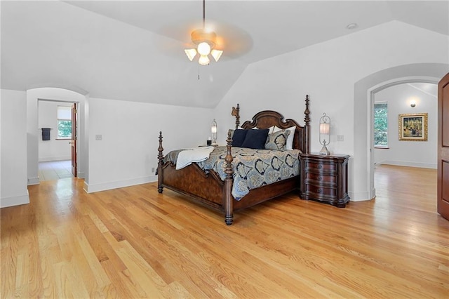 4043 Piedmont Lake Rd, Pine Mountain, GA 31822 - bedroom featuring arched walkways, vaulted ceiling, light wood-type flooring, a ceiling fan, and baseboards
