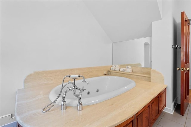 4043 Piedmont Lake Rd, Pine Mountain, GA 31822 - bathroom with vaulted ceiling, tile patterned flooring, and a jetted tub