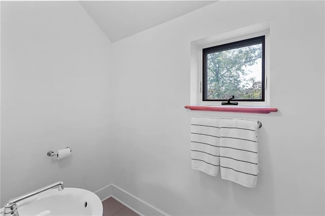 4043 Piedmont Lake Rd, Pine Mountain, GA 31822 - bathroom featuring lofted ceiling and baseboards