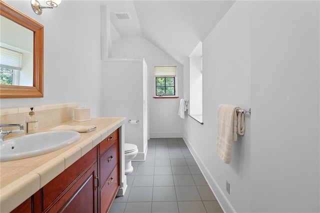 4043 Piedmont Lake Rd, Pine Mountain, GA 31822 - bathroom featuring toilet, vanity, lofted ceiling, tile patterned flooring, and baseboards
