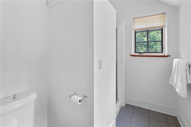 4043 Piedmont Lake Rd, Pine Mountain, GA 31822 - full bathroom featuring toilet, tile patterned floors, a shower with shower door, and baseboards