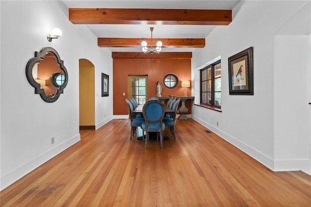 4043 Piedmont Lake Rd, Pine Mountain, GA 31822 - dining room featuring arched walkways, light wood-style floors, a chandelier, baseboards, and beamed ceiling