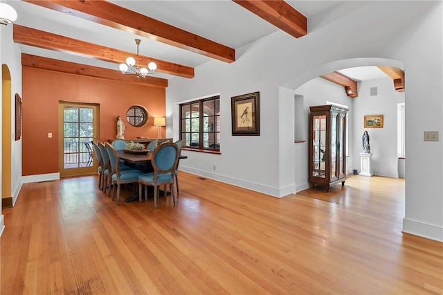 4043 Piedmont Lake Rd, Pine Mountain, GA 31822 - dining room with arched walkways, beamed ceiling, healthy amount of natural light, and light wood-type flooring