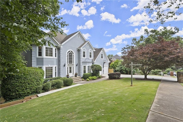 3260 Kingshouse Commons, Johns Creek, GA 30022 - colonial-style house featuring a front yard, stucco siding, and a residential view