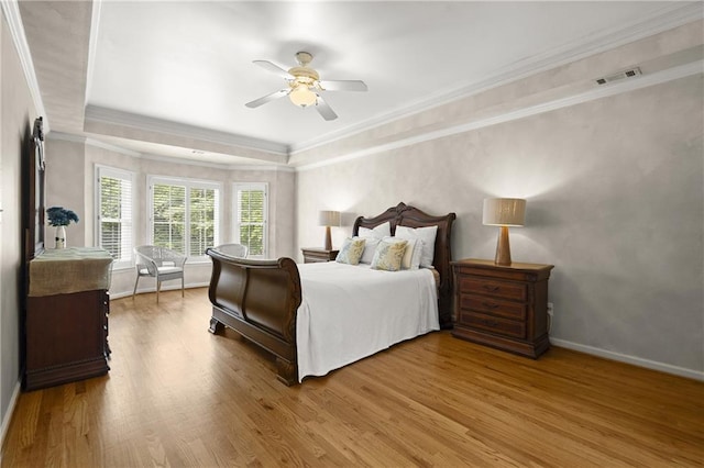 3260 Kingshouse Commons, Johns Creek, GA 30022 - bedroom with wood finished floors, ornamental molding, a ceiling fan, and a tray ceiling