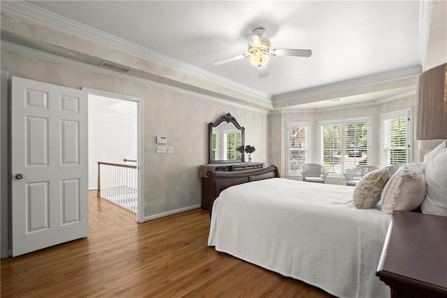3260 Kingshouse Commons, Johns Creek, GA 30022 - bedroom featuring wood finished floors, multiple windows, ornamental molding, ceiling fan, and a raised ceiling