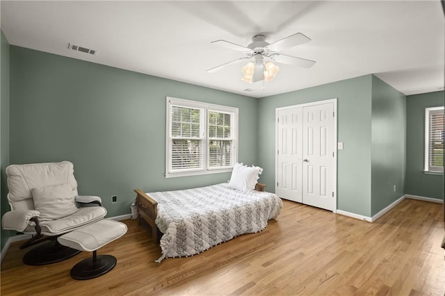 3260 Kingshouse Commons, Johns Creek, GA 30022 - bedroom with light wood-style floors, a closet, and a ceiling fan