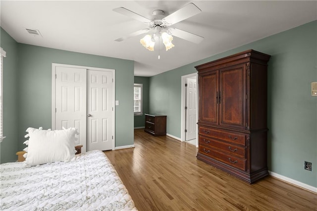 3260 Kingshouse Commons, Johns Creek, GA 30022 - bedroom featuring wood finished floors, a closet, and ceiling fan