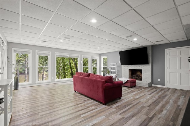 3260 Kingshouse Commons, Johns Creek, GA 30022 - living room with a drop ceiling, wood finished floors, plenty of natural light, and a fireplace