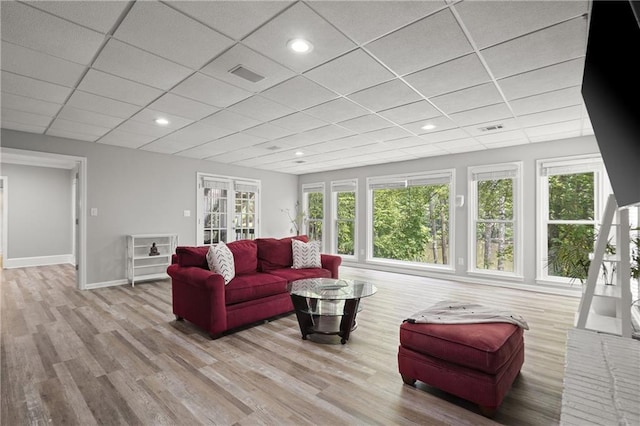 3260 Kingshouse Commons, Johns Creek, GA 30022 - living room with healthy amount of natural light, a paneled ceiling, and wood finished floors