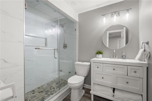 3260 Kingshouse Commons, Johns Creek, GA 30022 - bathroom featuring vanity, a shower stall, and wood finished floors
