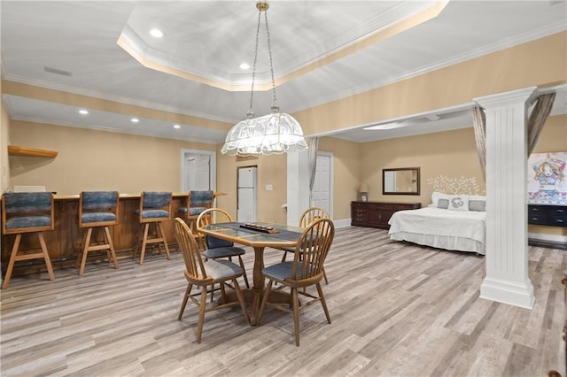3260 Kingshouse Commons, Johns Creek, GA 30022 - dining space featuring ornate columns, crown molding, light wood-style floors, a tray ceiling, and recessed lighting