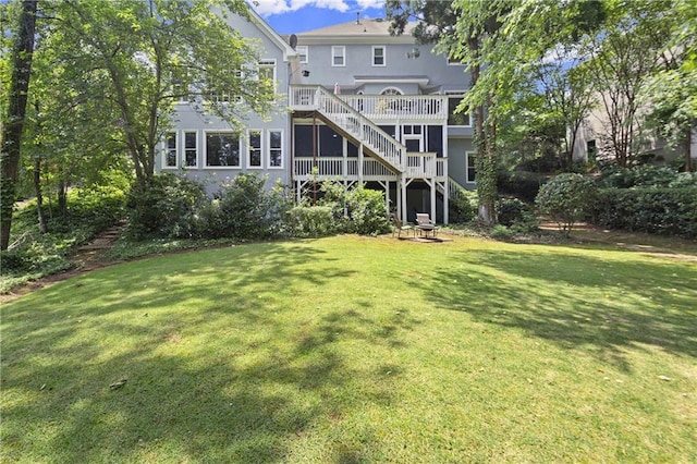 3260 Kingshouse Commons, Johns Creek, GA 30022 - rear view of house with stairway, a lawn, a wooden deck, and stucco siding