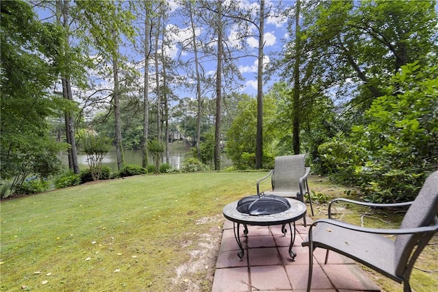 3260 Kingshouse Commons, Johns Creek, GA 30022 - view of green lawn with an outdoor fire pit and view of scattered trees