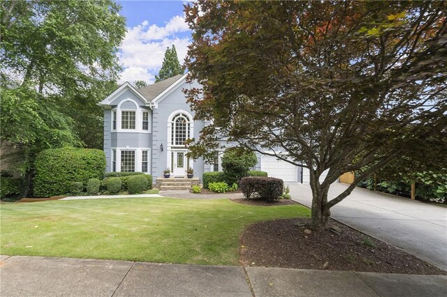 3260 Kingshouse Commons, Johns Creek, GA 30022 - view of front of house featuring driveway and a front yard