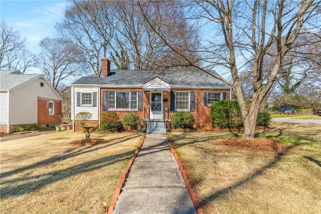 bungalow-style house with a front lawn, brick siding, and a chimney