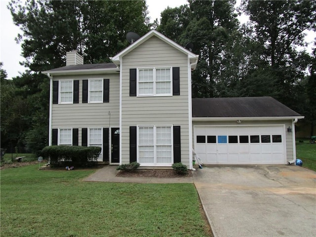 view of front facade featuring a garage and a front yard