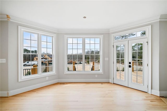 unfurnished sunroom with french doors