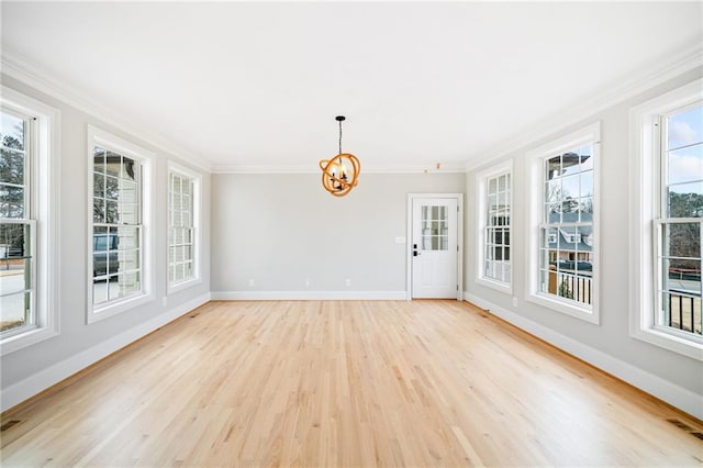 unfurnished sunroom featuring a notable chandelier