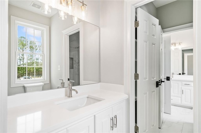 bathroom with vanity and toilet