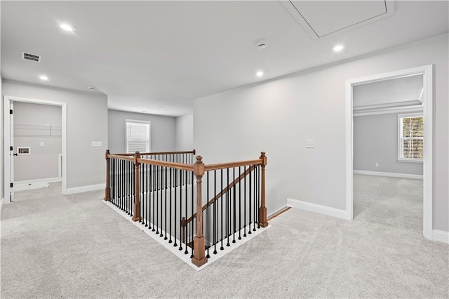 313 Foxglove Way, Mcdonough, GA 30253 - corridor with an upstairs landing, attic access, visible vents, light carpet, and recessed lighting