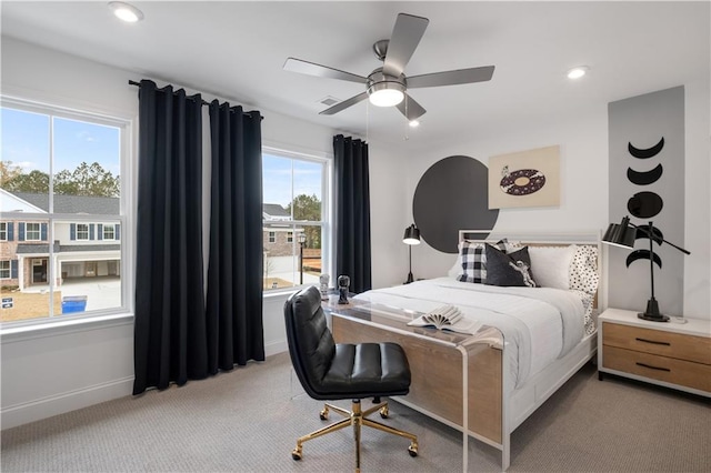 bedroom with light colored carpet and ceiling fan