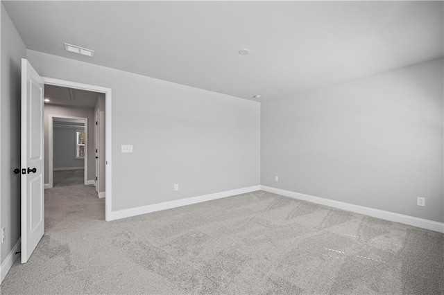 313 Foxglove Way, Mcdonough, GA 30253 - spare room with carpet flooring, attic access, visible vents, and baseboards