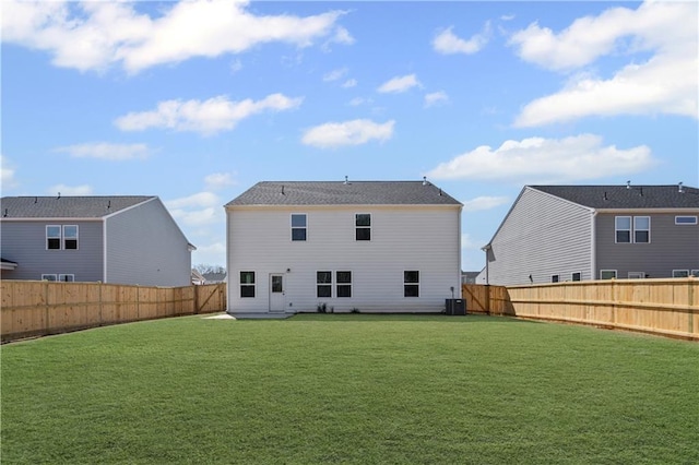 313 Foxglove Way, Mcdonough, GA 30253 - back of house featuring a fenced backyard, a yard, and central AC unit