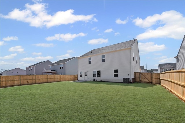 313 Foxglove Way, Mcdonough, GA 30253 - rear view of house with central air condition unit, a residential view, a lawn, and a fenced backyard