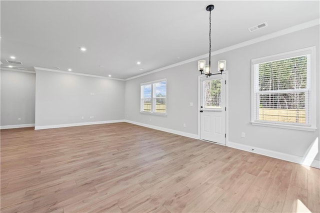 313 Foxglove Way, Mcdonough, GA 30253 - unfurnished dining area with light wood-style floors, crown molding, visible vents, and an inviting chandelier