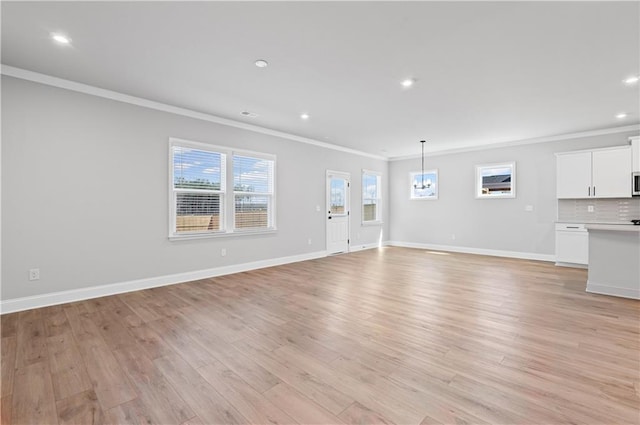 313 Foxglove Way, Mcdonough, GA 30253 - unfurnished living room featuring light wood-style flooring, baseboards, ornamental molding, and recessed lighting