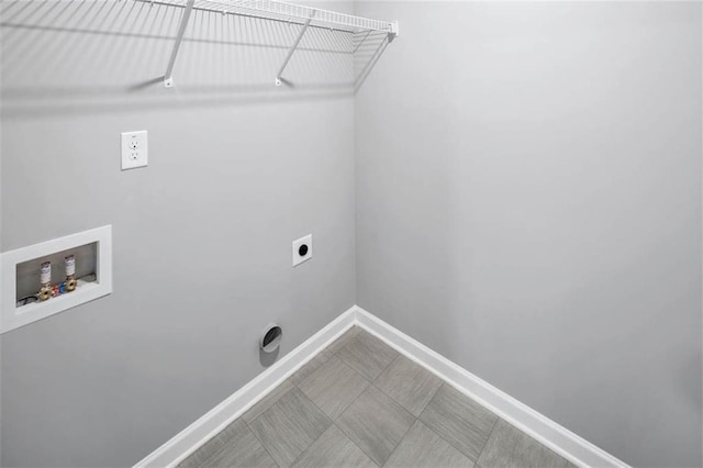 laundry area featuring laundry area, baseboards, washer hookup, and electric dryer hookup