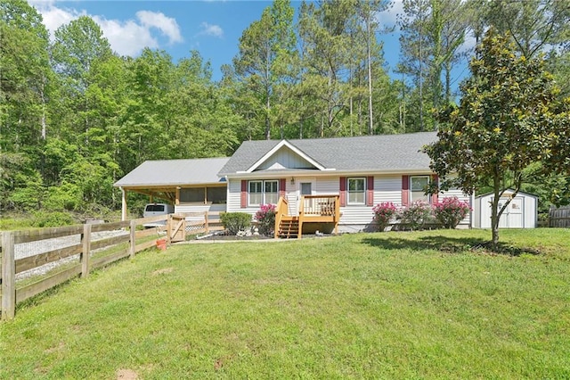 ranch-style house with a storage unit, an outdoor structure, and roof with shingles