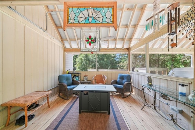 sunroom / solarium with an outdoor fire pit