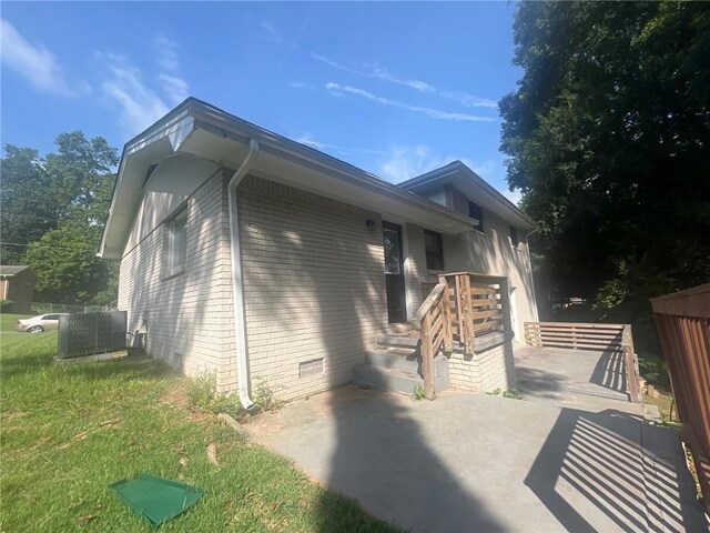 1870 Glen Echo Dr, Decatur, GA 30032 - view of side of property with a patio, a yard, and central air condition unit