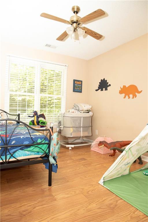 1473 Wildwood Way, Hampton, GA 30228 - bedroom with wood finished floors and a ceiling fan