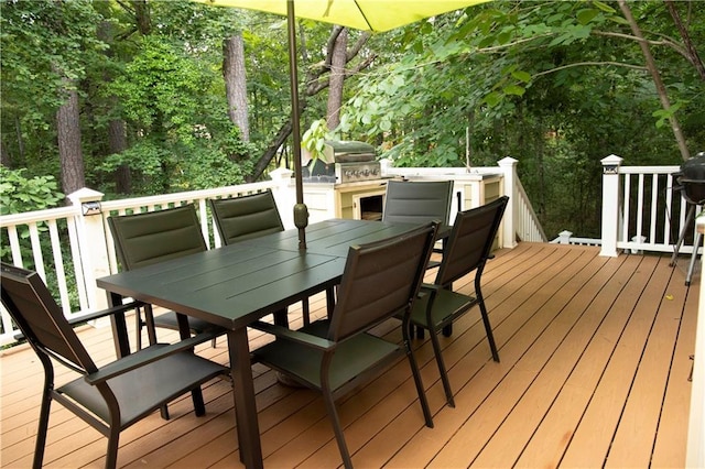1473 Wildwood Way, Hampton, GA 30228 - wooden terrace featuring a grill and outdoor dining area