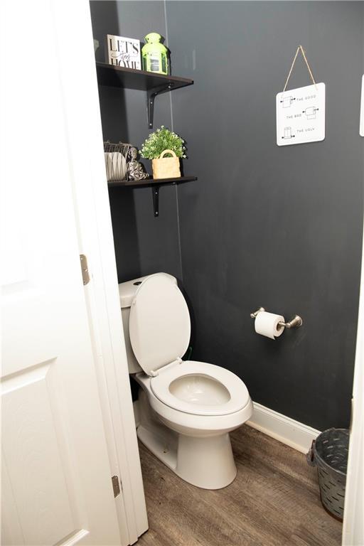 1473 Wildwood Way, Hampton, GA 30228 - bathroom with toilet and wood finished floors