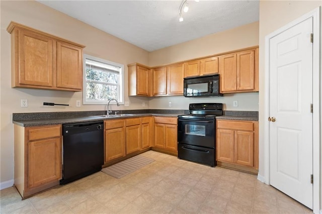 kitchen featuring sink and black appliances