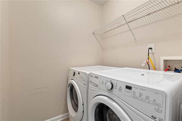 laundry area with washing machine and dryer