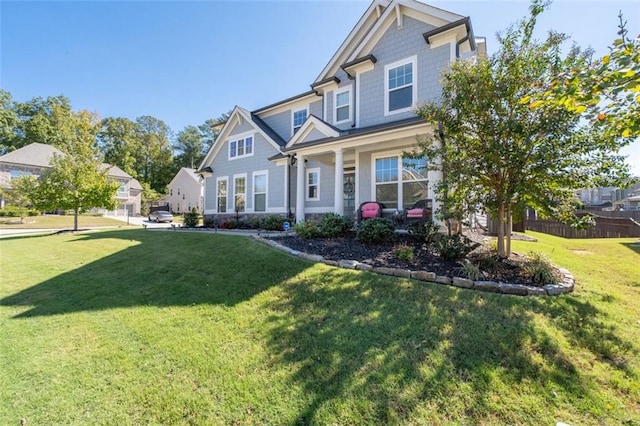 craftsman house with a front lawn