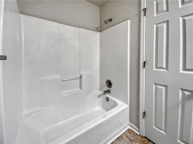 bathroom with tub / shower combination