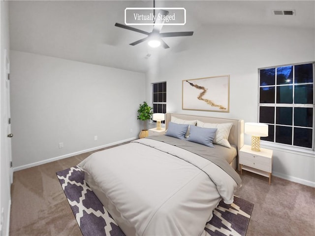 bedroom with dark carpet, ceiling fan, and vaulted ceiling