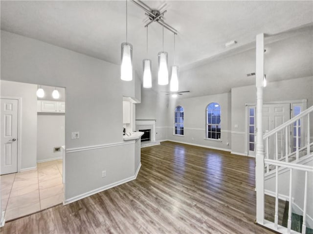 unfurnished living room featuring wood-type flooring